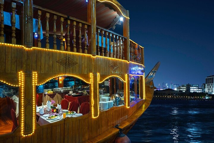Savor an unforgettable evening on a traditional dhow enjoying international cuisine while gliding past Dubai’s iconic skyline and historic landmarks along the serene Creek.